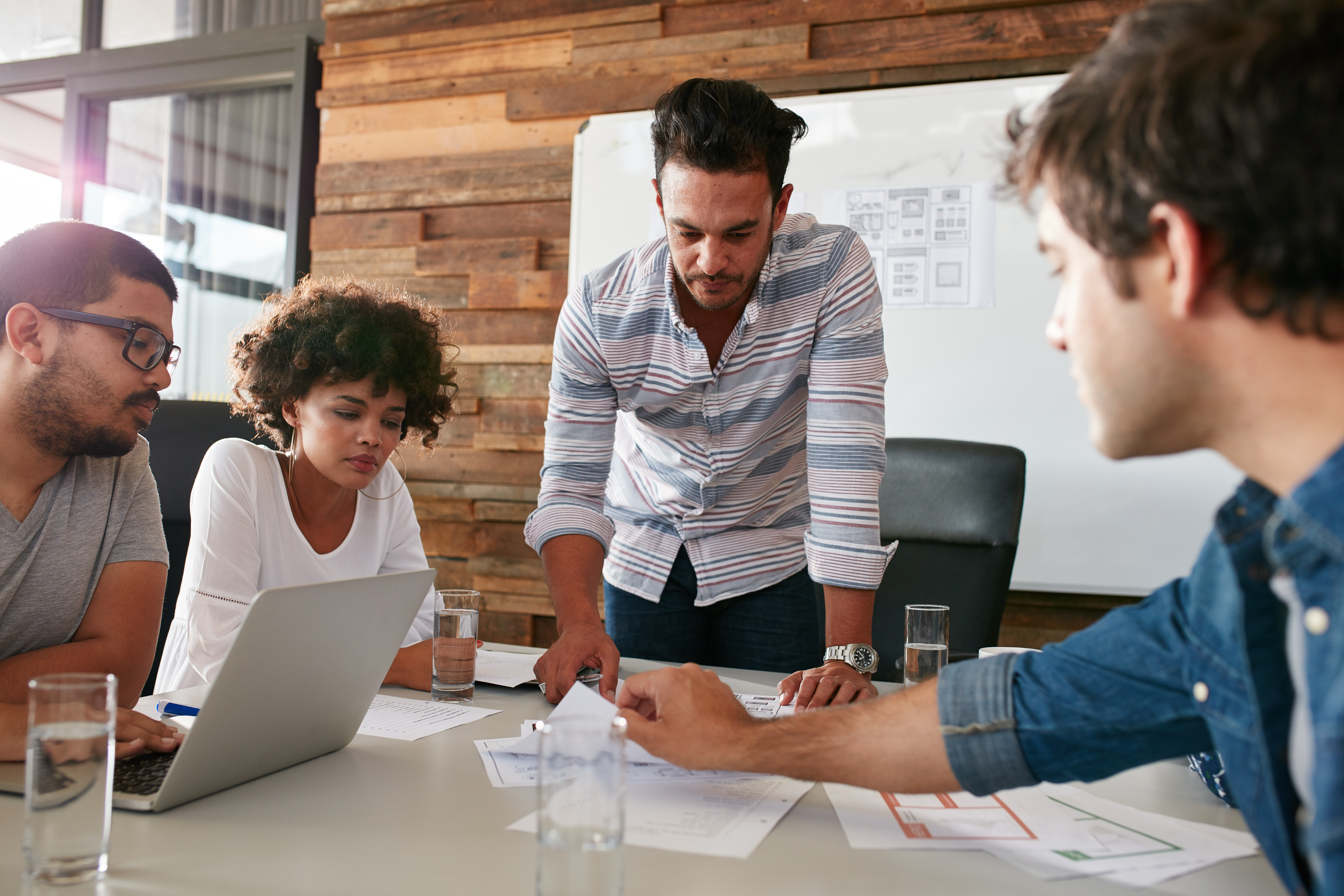 four people having a digital marketing meeting