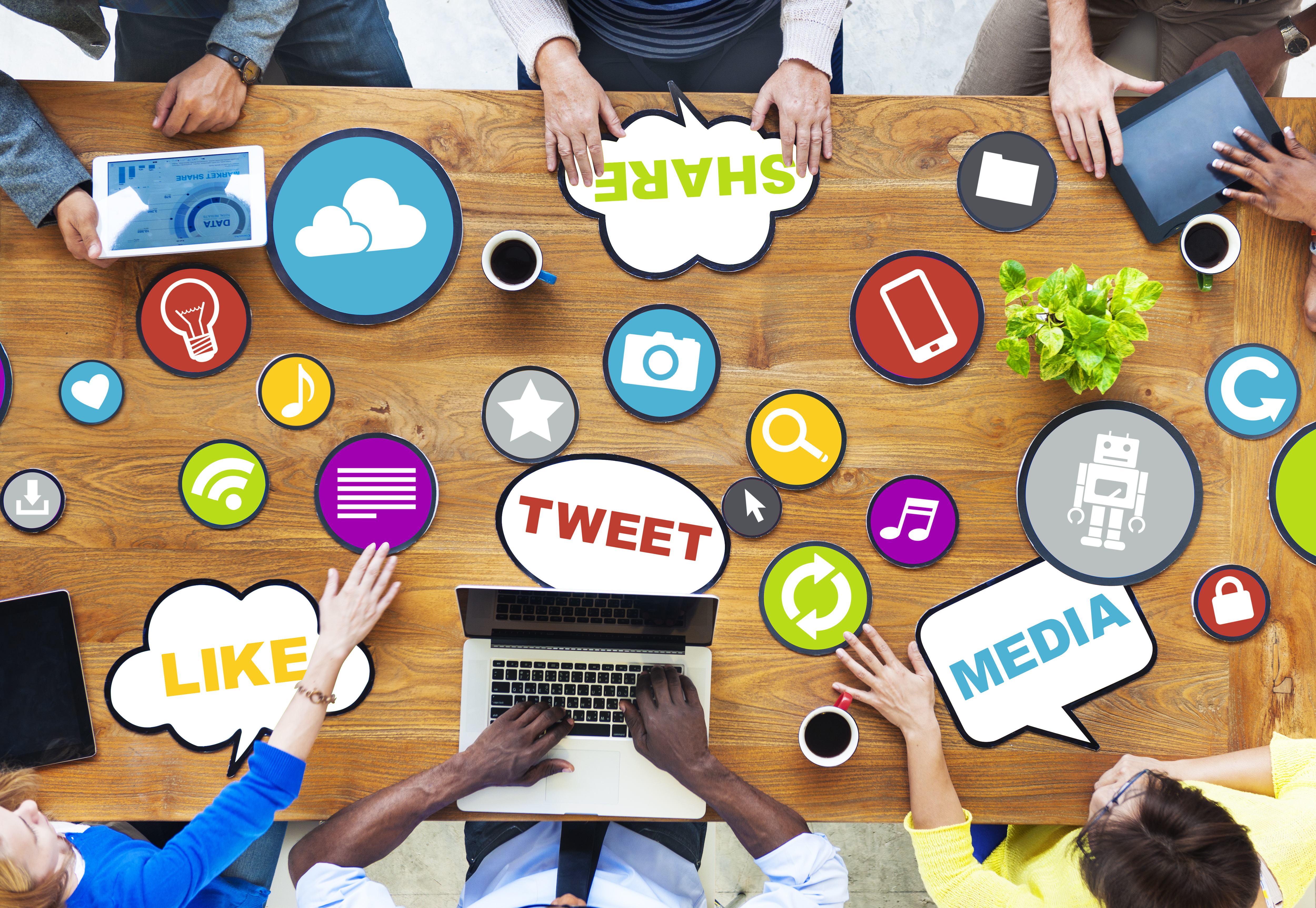 team meeting with various social media icons